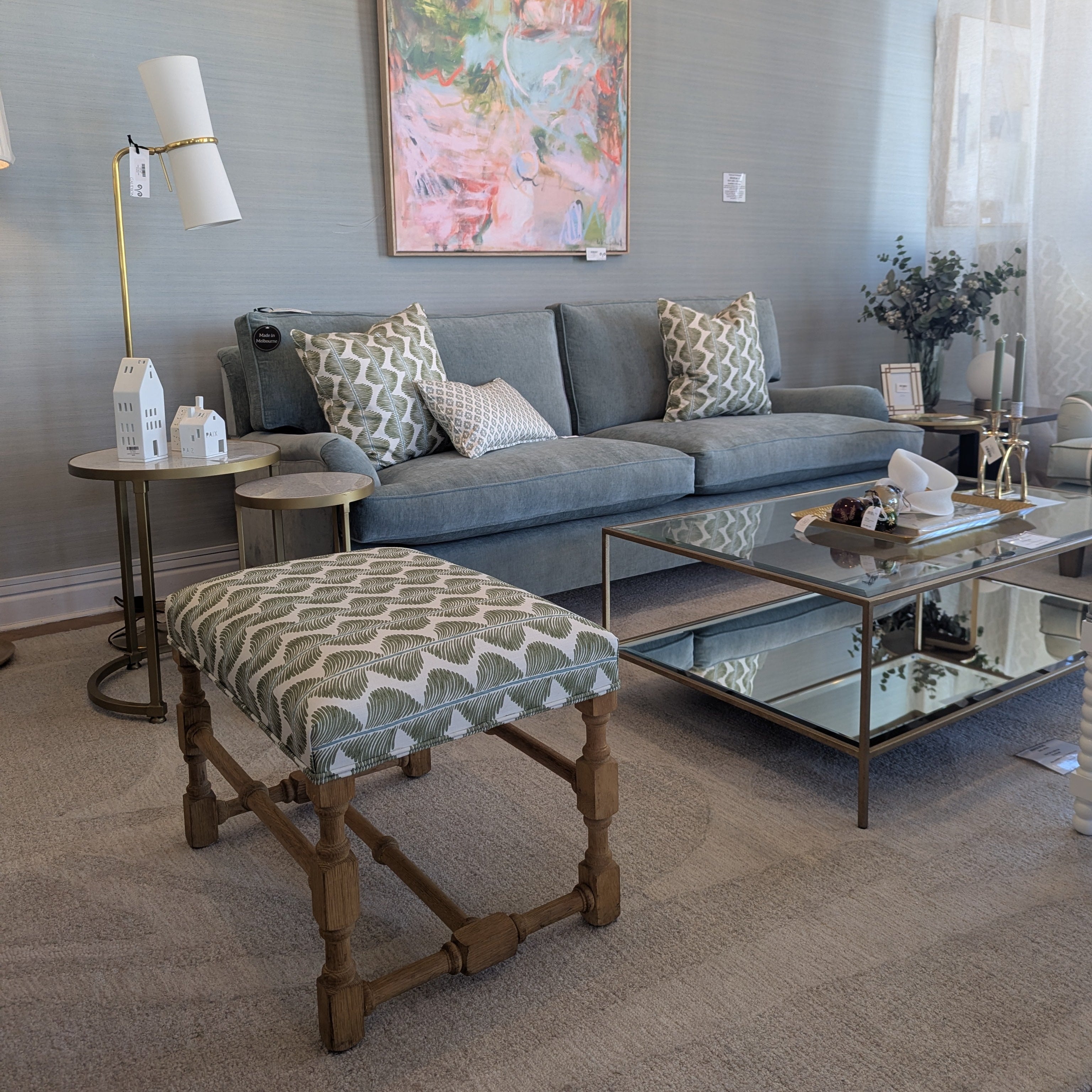 ROMO UK Aubin fabric on upholstered custom ottoman with oak legs in lounge setting