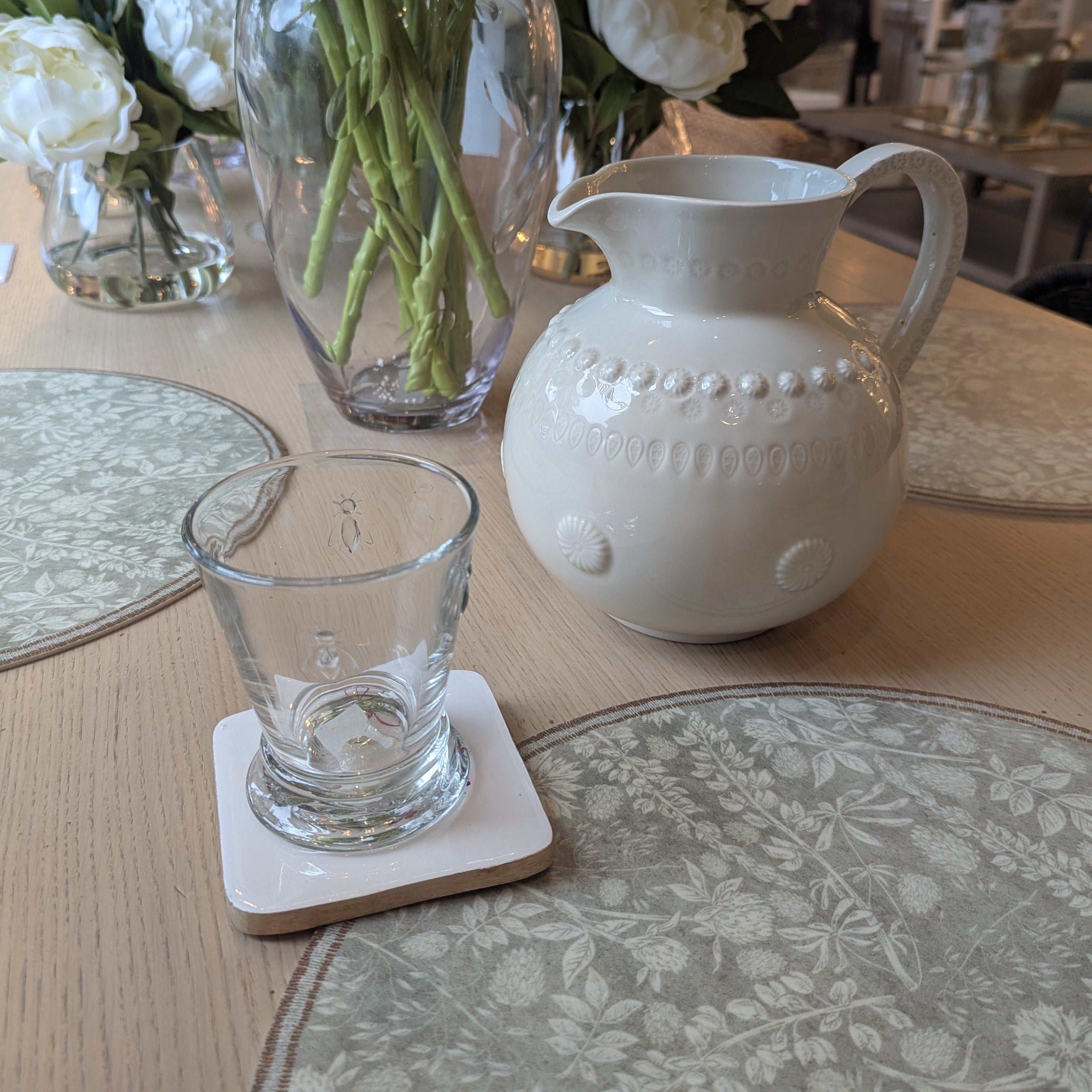 Set of 4 christmas coasters with wreath design and christmas sayings.