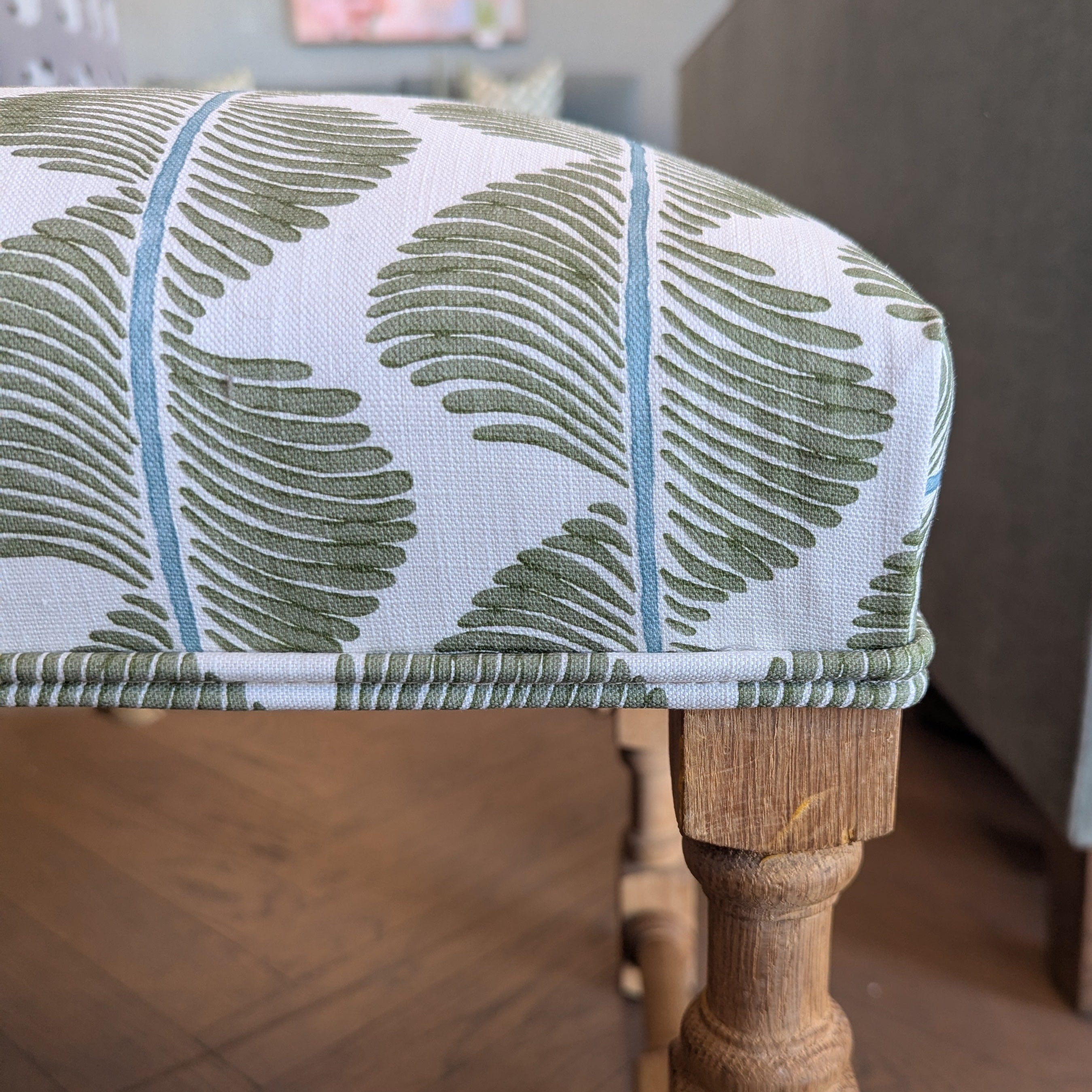 ROMO  UK Aubin fabric on upholstered custom ottoman with oak legs.
