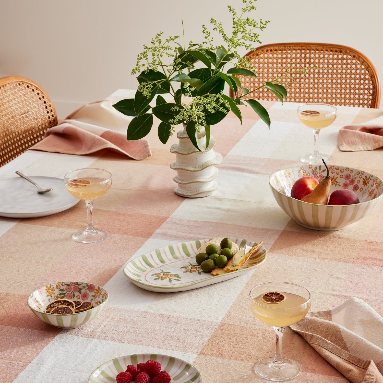 bowls with pink and green floral details with stripe on outside. Gaudion furniture