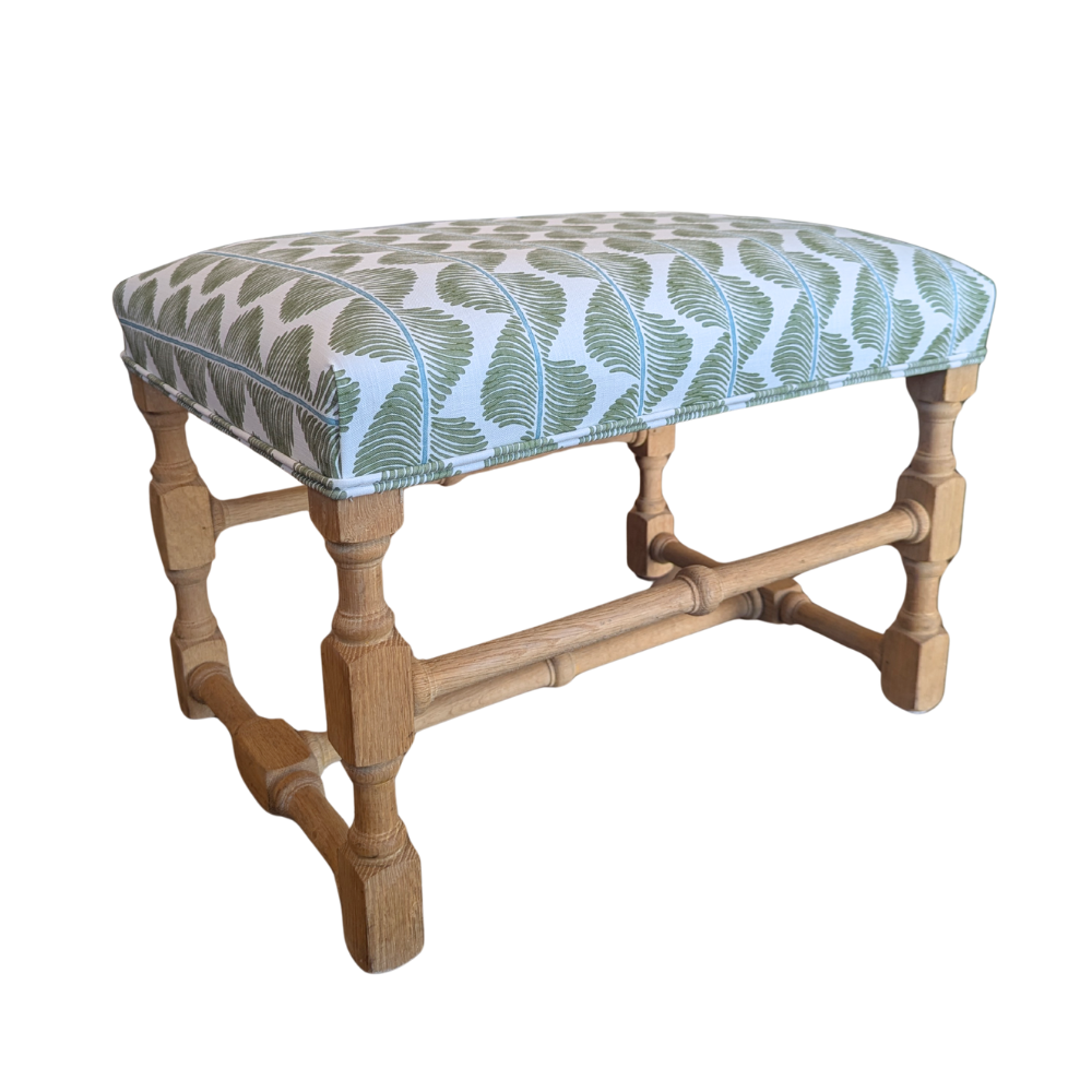 ROMO  UK Aubin fabric on upholstered custom ottoman with oak legs.