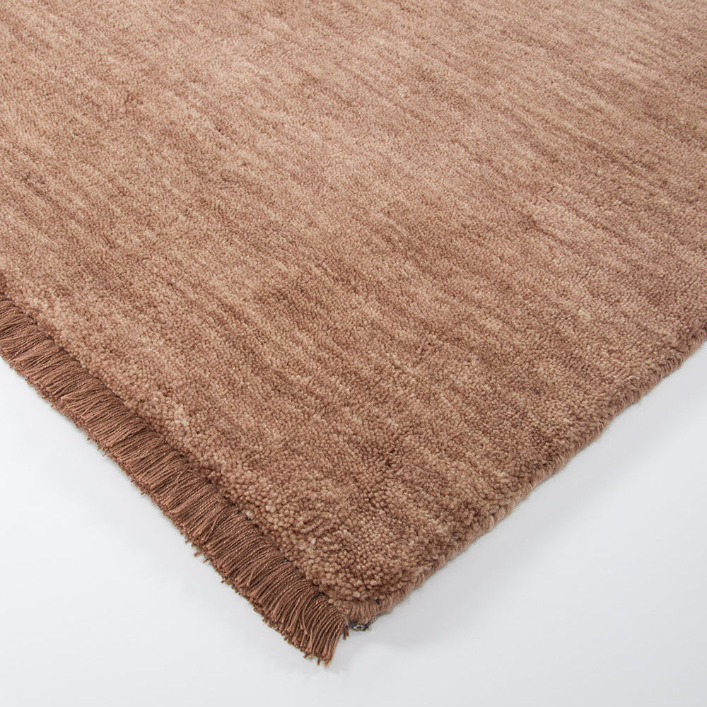 Sandringham rug rosewood with fringe. Gaudion furniture
